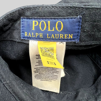 Raree Finds Polo Ralph Lauren hat interior tag with blue brand label, care instructions, and yellow QR code tag.