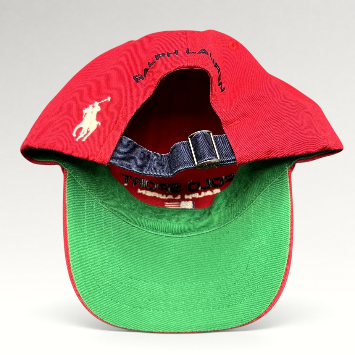 Raree Finds vintage red Polo Sport Ralph Lauren strapback cap with green undervisor and rear embroidered pony logo