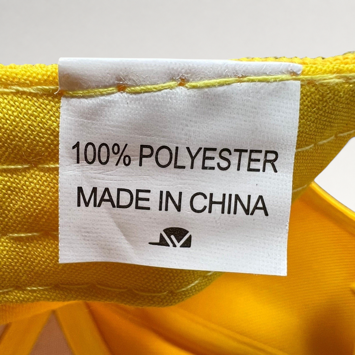 Raree Finds All American TV show crew hat interior tag showing 100 percent polyester material and made in China label