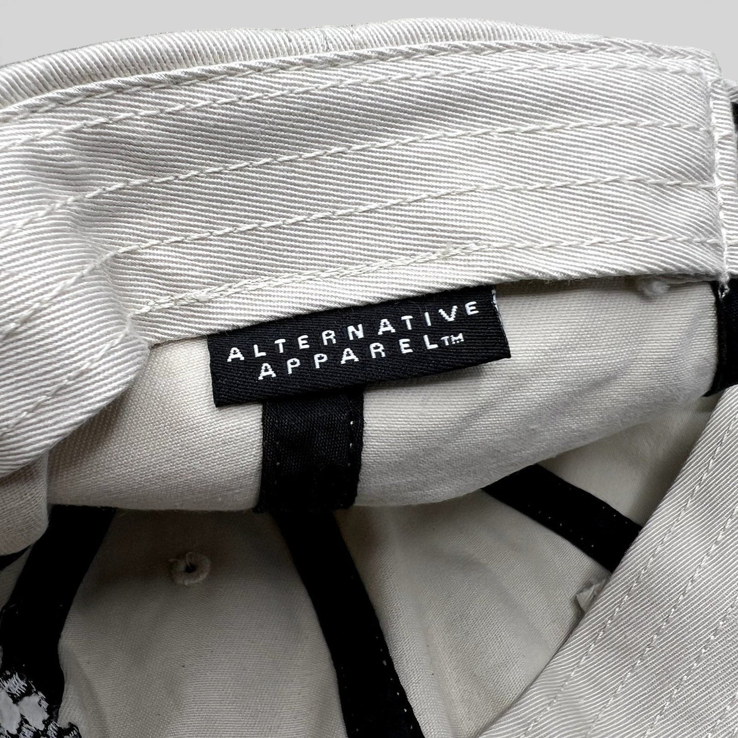 Raree Finds Porsche Driving Experience hat interior featuring an Alternative Apparel brand label on cream fabric