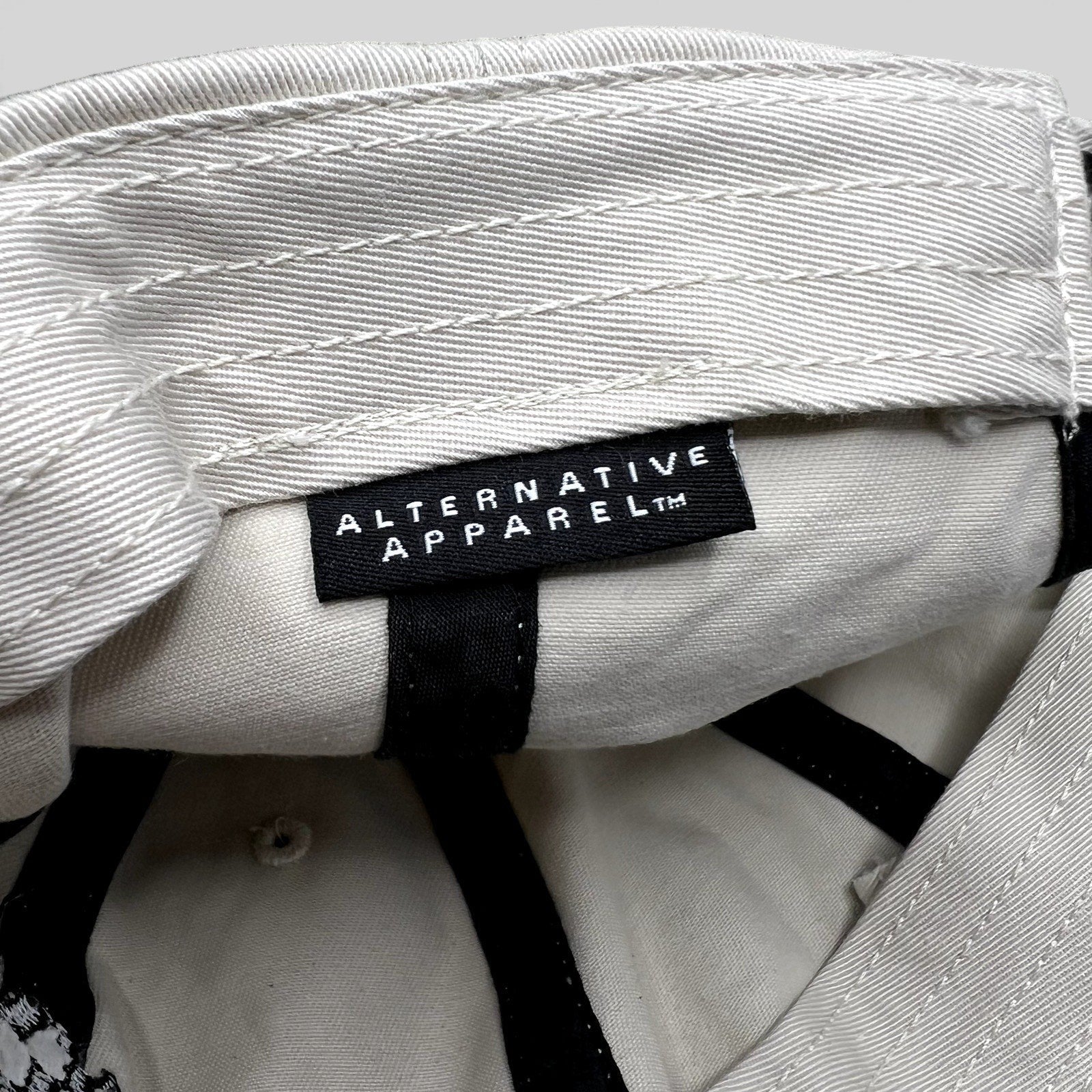 Raree Finds Porsche Driving Experience hat interior featuring an Alternative Apparel brand label on cream fabric