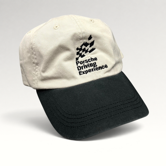 Raree Finds Porsche Driving Experience strapback hat in black and cream with embroidered logo and unstructured fit.