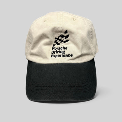 Raree Finds Porsche Driving Experience two-tone strapback hat in cream and black with embroidered logo