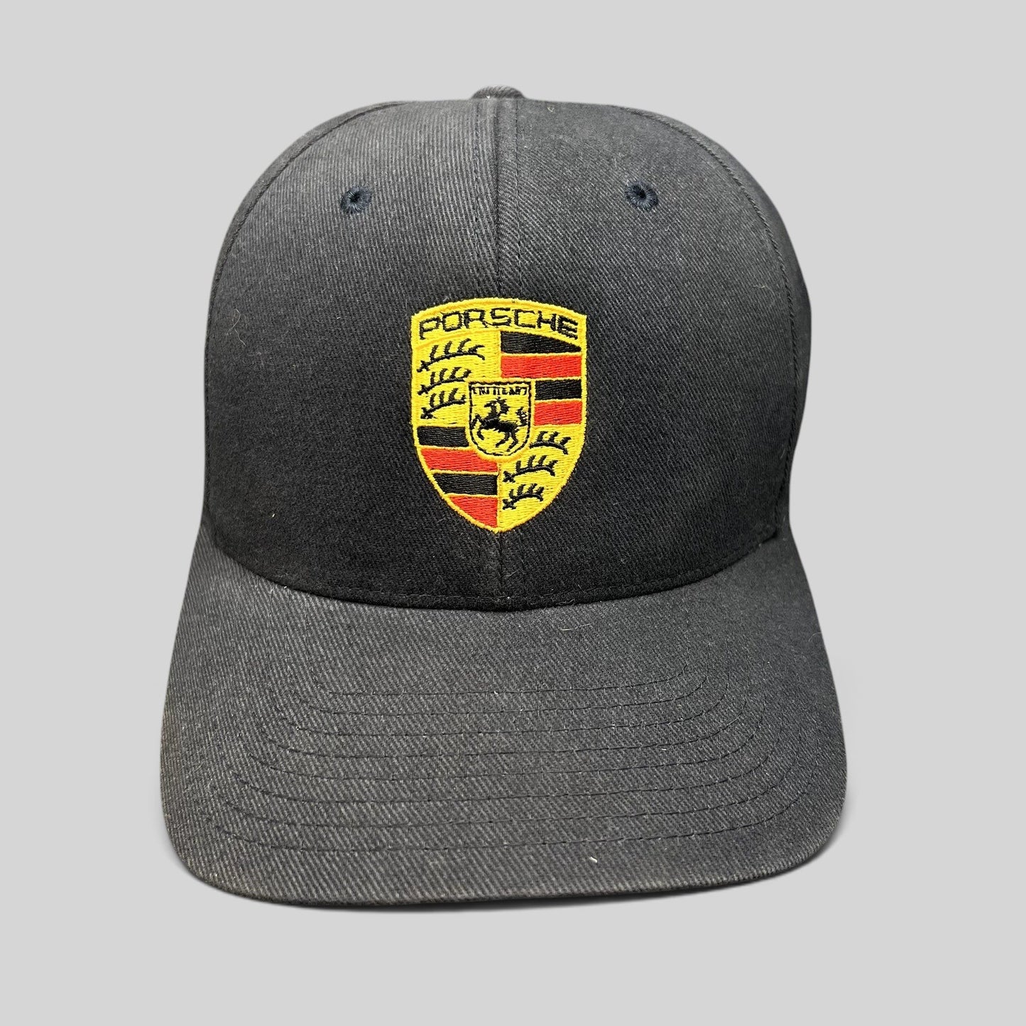 Raree Finds black Porsche Woodland Hills Flexfit hat with embroidered crest logo on the front