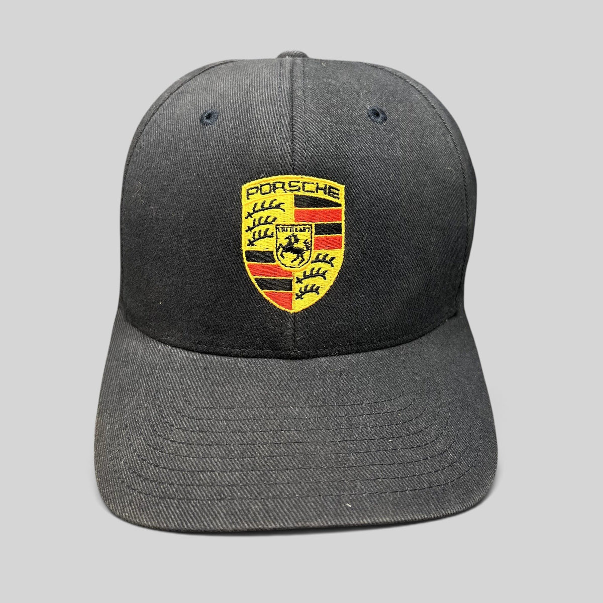 Raree Finds black Porsche Woodland Hills Flexfit hat with embroidered crest logo on the front