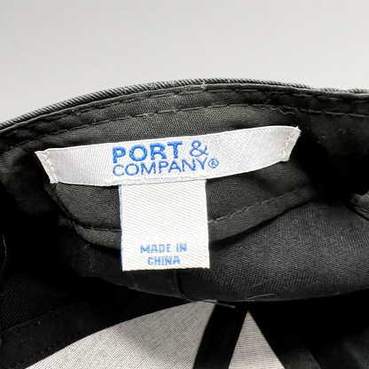 Raree Finds black strapback hat interior showing the Port & Company brand label and Made in China tag
