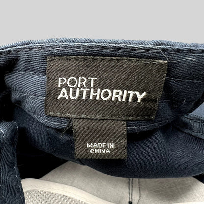 Raree Finds Port Authority navy blue snapback hat interior label showing brand name and Made in China tag
