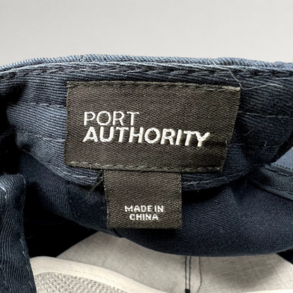 Raree Finds Port Authority navy blue snapback hat interior label showing brand name and Made in China tag