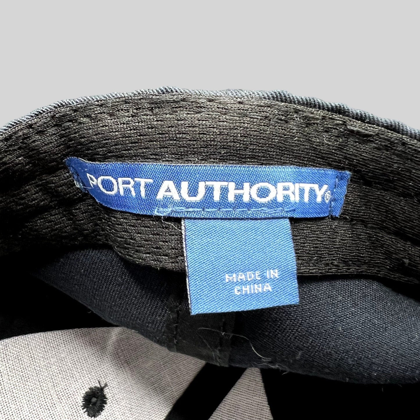Raree Finds vintage Port Authority hat interior label showing blue brand tag and Made in China origin tag