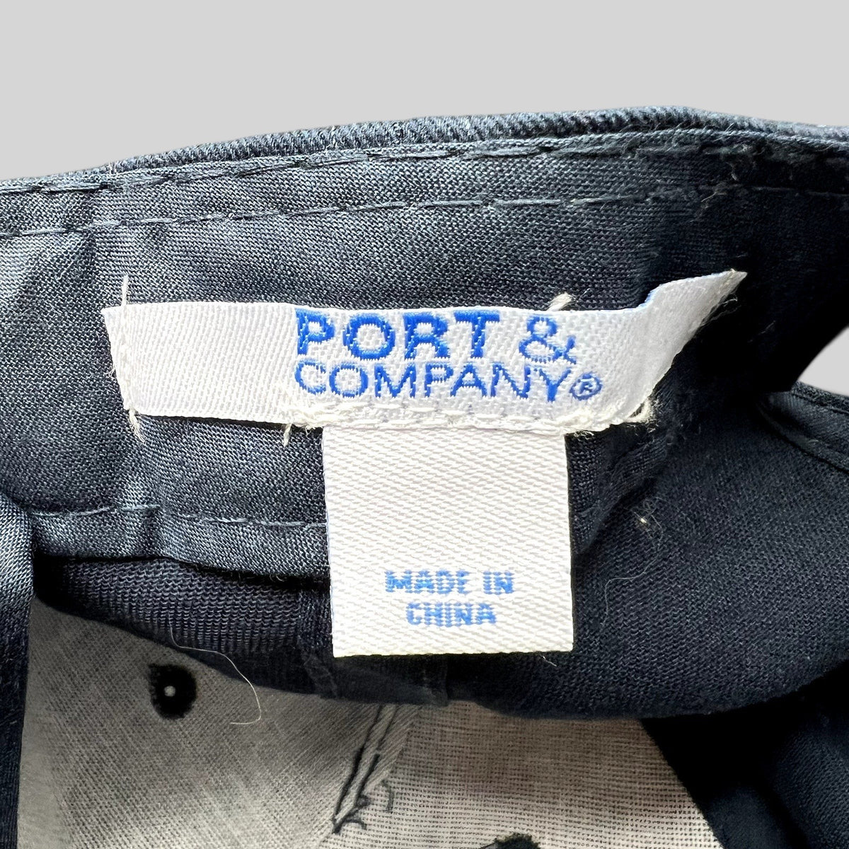 Raree Finds Port & Company brand label inside a black Legion Marvel TV series strapback hat made in China