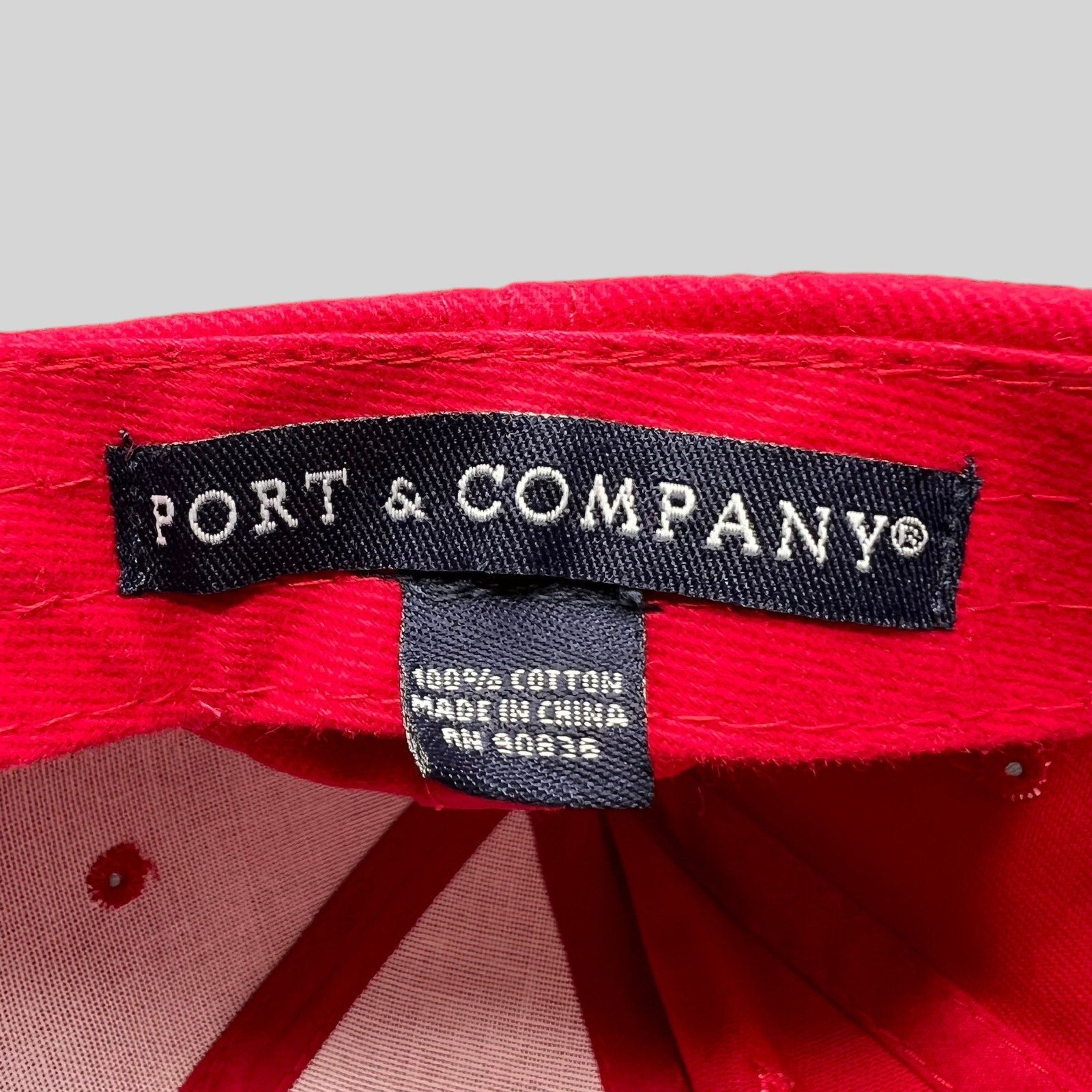 Raree Finds Port & Company brand label inside a red cotton hat from the 2010 Little Fockers movie promotion.