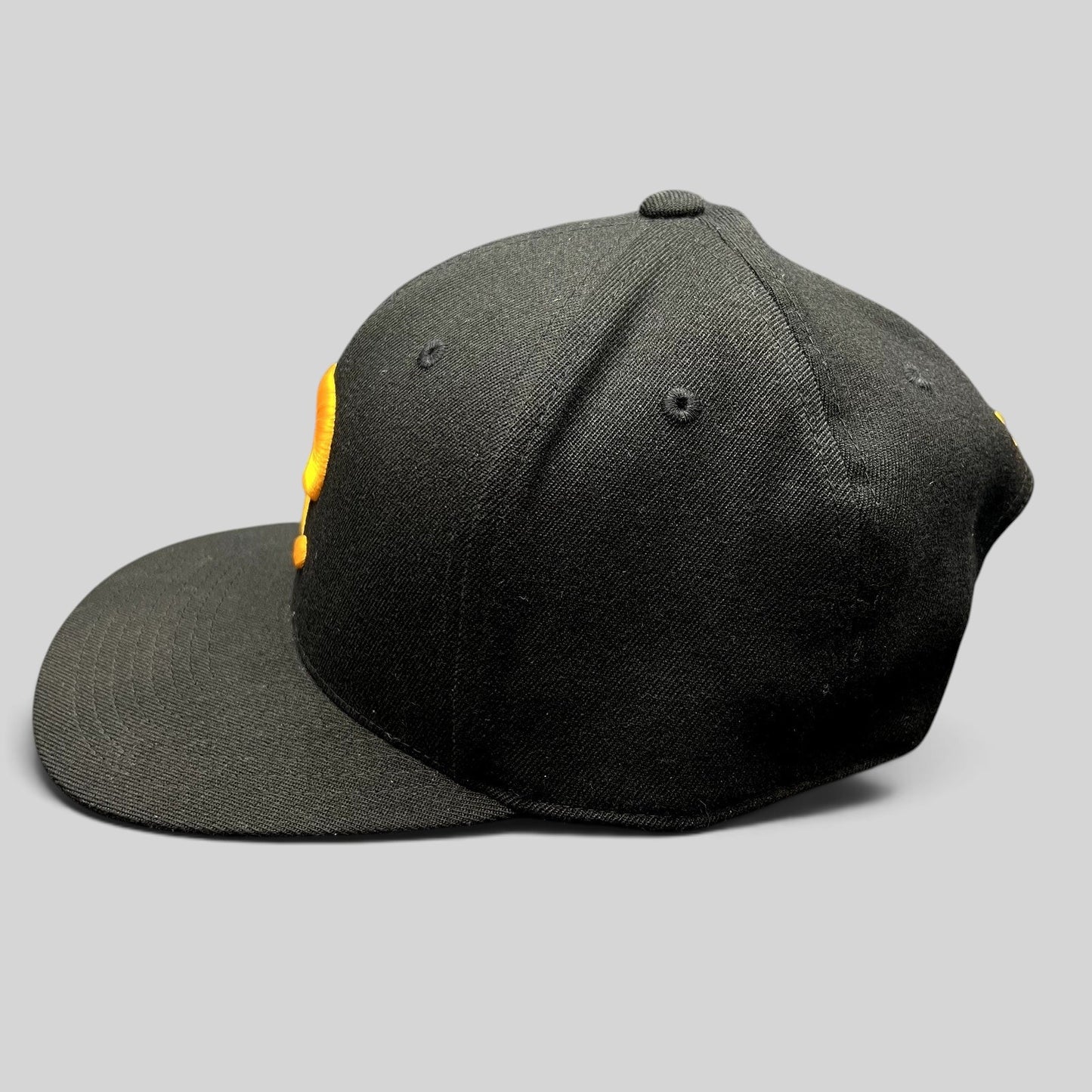 Raree Finds Postino restaurant snapback hat in black with a gold embroidered P logo on a structured Yupoong 110 cap.