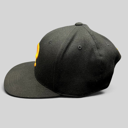 Raree Finds Postino restaurant snapback hat in black with a gold embroidered P logo on a structured Yupoong 110 cap.