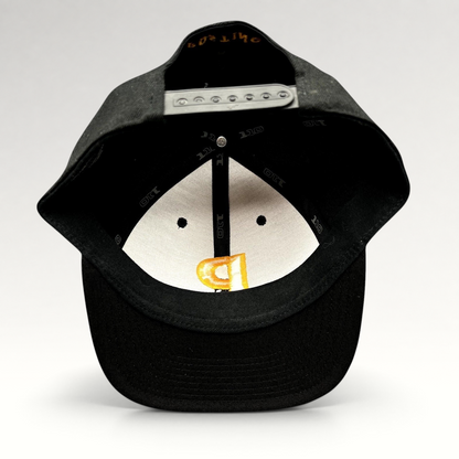 Raree Finds Postino restaurant snapback hat interior view showing Yupoong 110 Flexfit branding and adjustable closure.