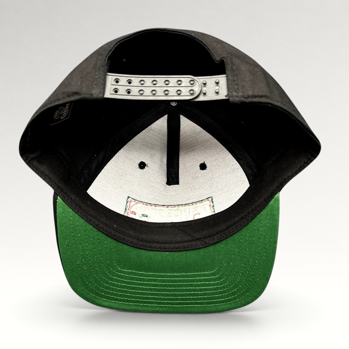 Raree Finds Prince St Pizza Los Angeles black snapback hat with green undervisor and adjustable plastic closure
