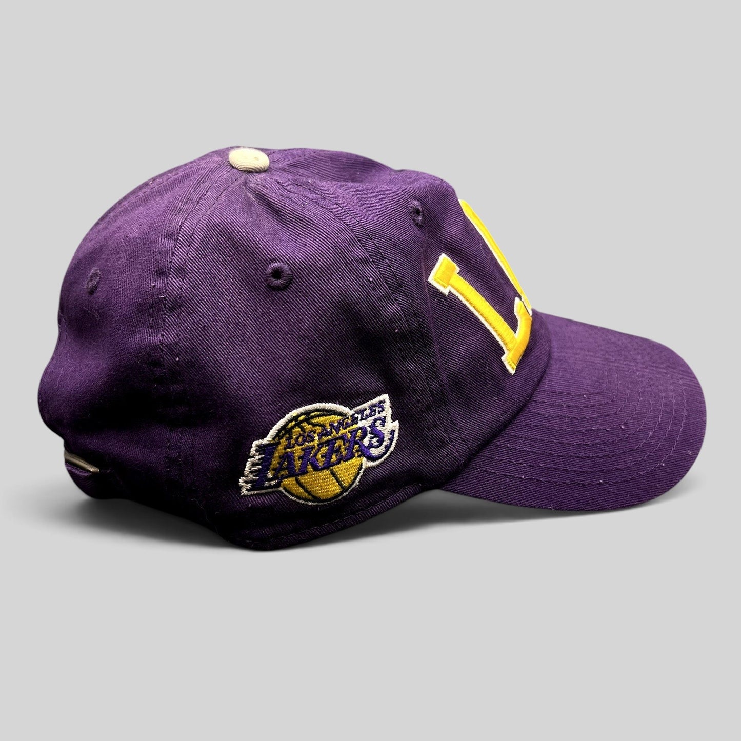 Raree Finds purple Los Angeles Lakers strapback hat with yellow LAL embroidery and side team logo patch