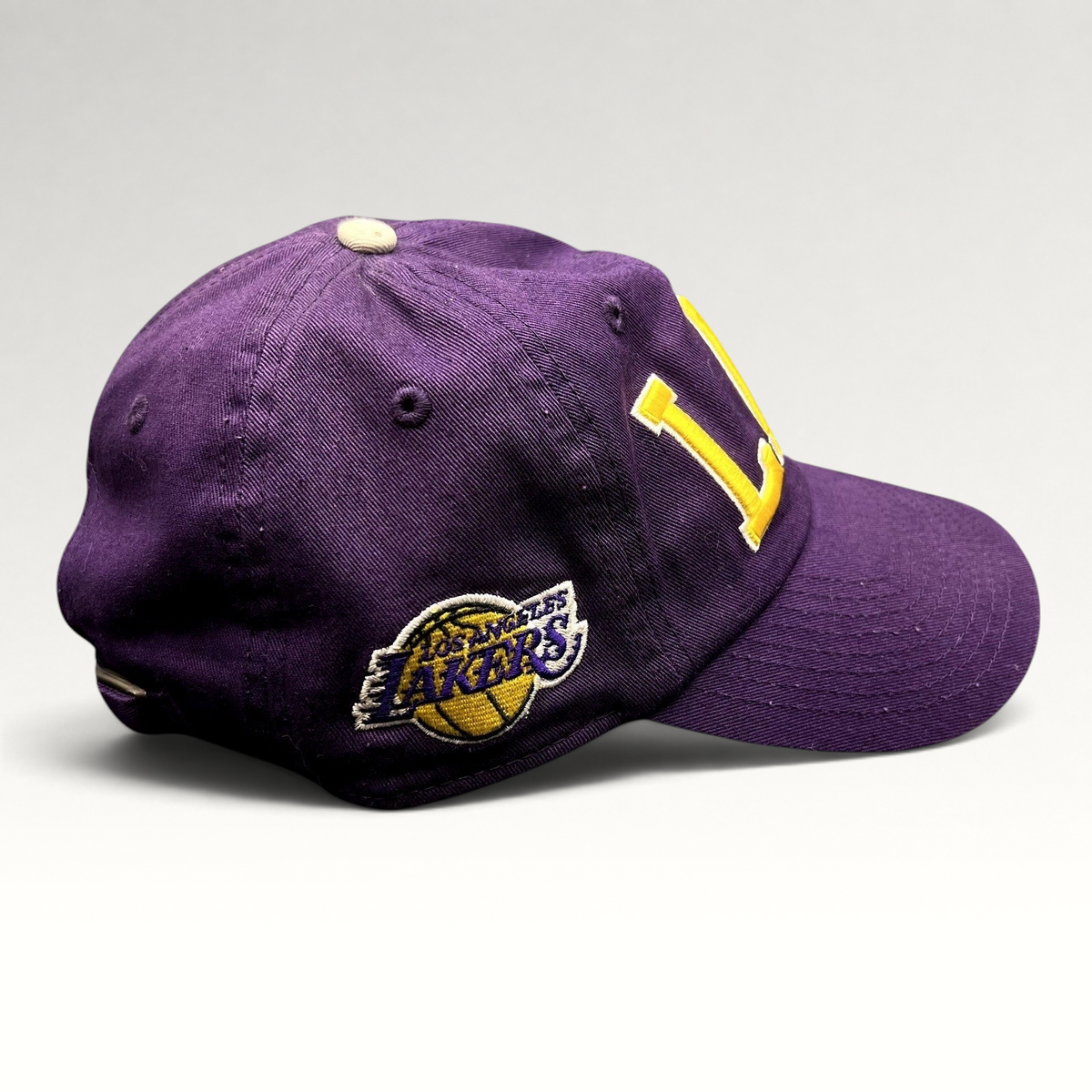 Raree Finds purple Los Angeles Lakers strapback hat with yellow LAL embroidery and side team logo patch