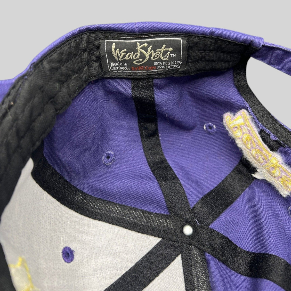 Raree Finds vintage HeadShots purple strapback cap interior showing brand label and Marshmallow Peeps brim embroidery