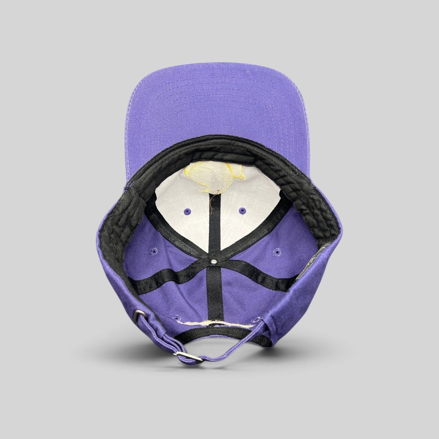 Raree Finds vintage purple Marshmallow Peeps strapback cap showing interior lining and adjustable metal buckle