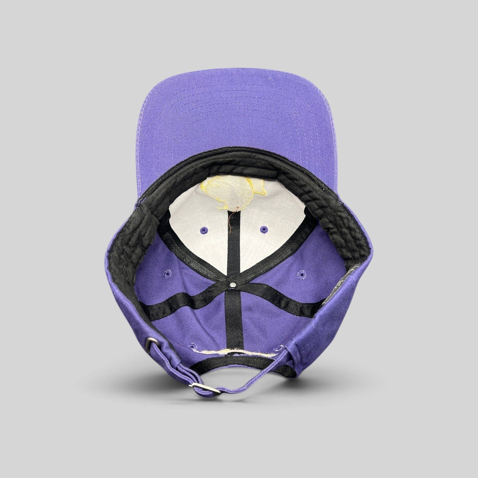 Raree Finds vintage purple Marshmallow Peeps strapback cap showing interior lining and adjustable metal buckle