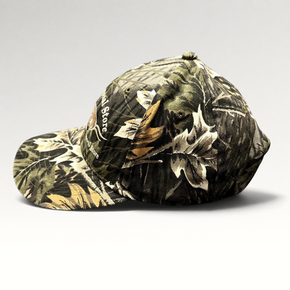 Raree Finds Putney General Store woodland camouflage strapback hat with embroidered Vermont logo and curved brim.