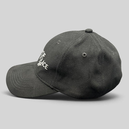 Raree Finds black Quantum of Solace 007 strapback hat with white embroidered film title and gun logo on curved bill