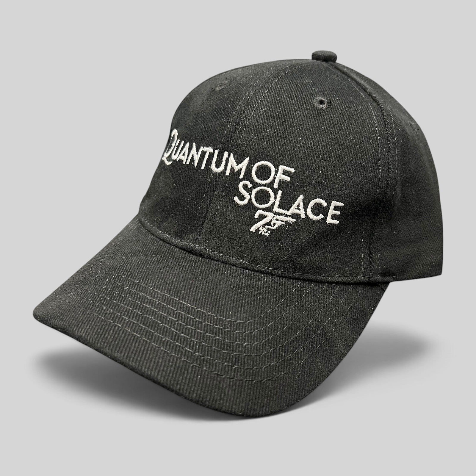 Raree Finds black Quantum of Solace 007 promotional strapback hat with white embroidered film logo on curved bill cap