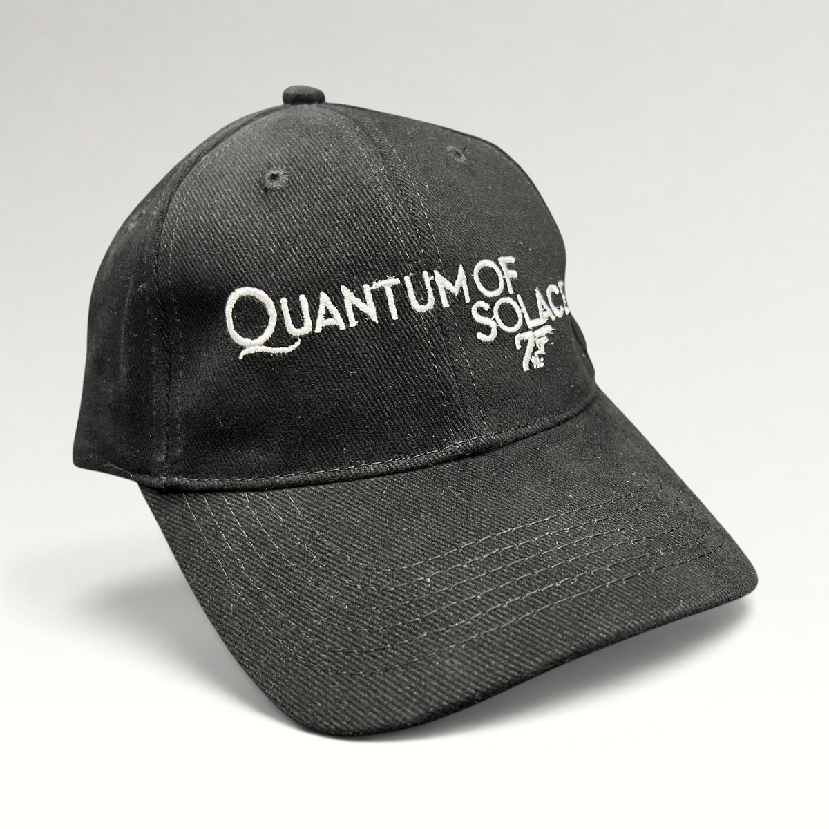 Raree Finds black Quantum of Solace 007 promotional strapback hat with white embroidered movie title and gun logo