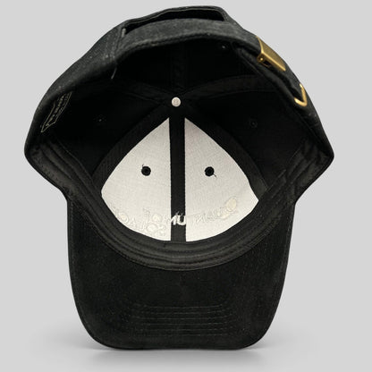 Raree Finds black Quantum of Solace 007 strapback hat showing the interior lining and brass buckle closure.