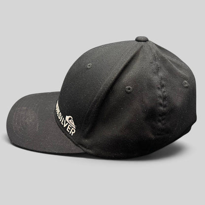Raree Finds black Quiksilver Flexfit cap with white embroidered mountain and wave logo on a structured crown