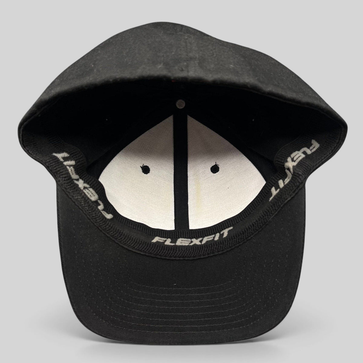 Raree Finds black Quiksilver Flexfit cap interior showing white lining and branded sweatband