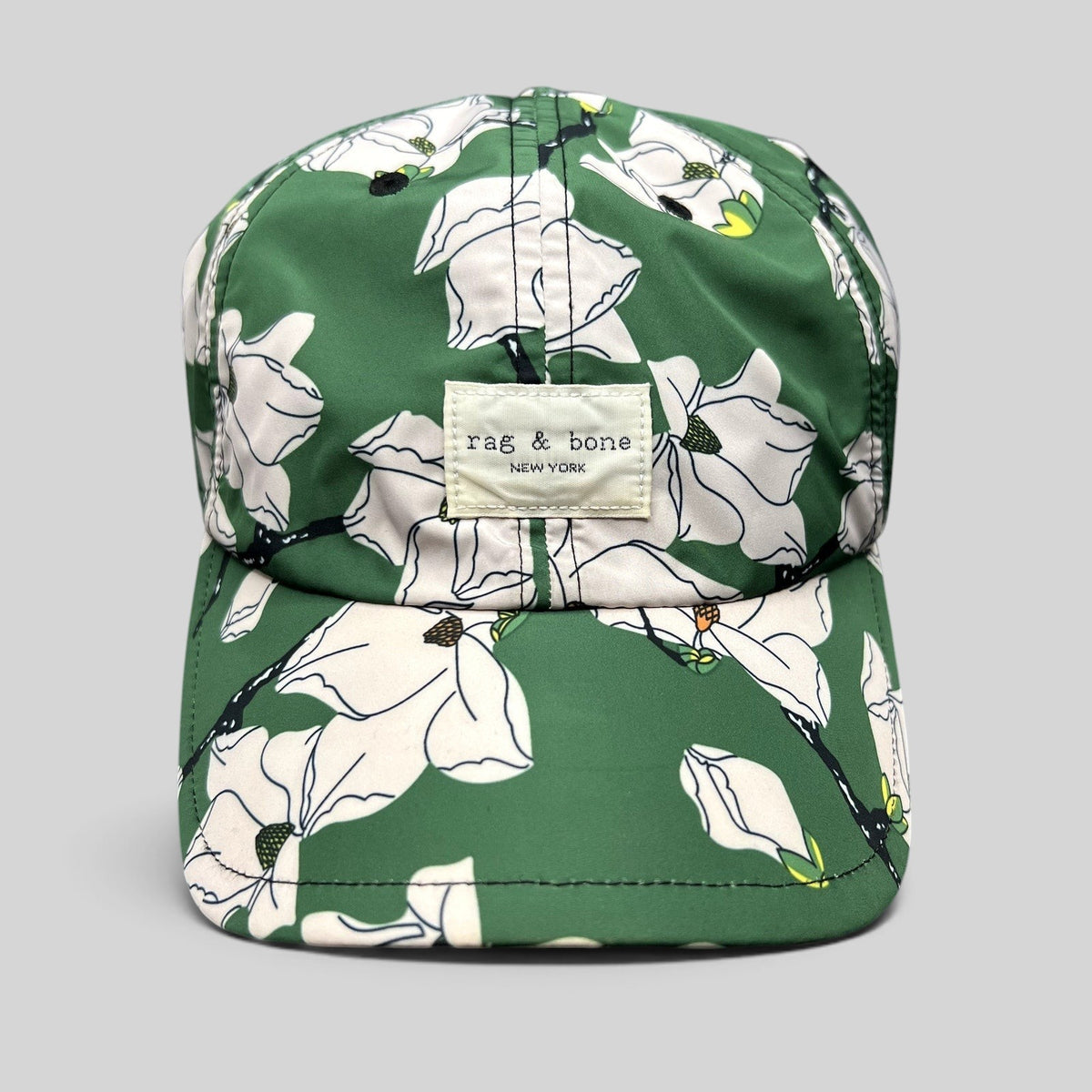 Raree Finds Rag & Bone New York green magnolia floral print strapback cap with a curved brim and logo patch