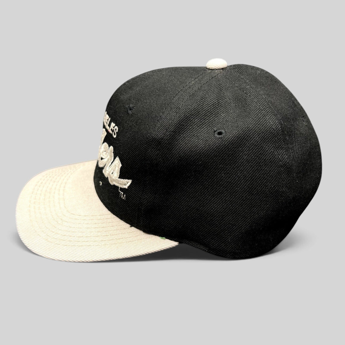 Raree Finds vintage Sports Specialties Los Angeles Raiders snapback hat with black crown and white brim