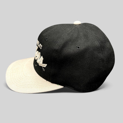 Raree Finds vintage Sports Specialties Los Angeles Raiders snapback hat with black crown and white brim