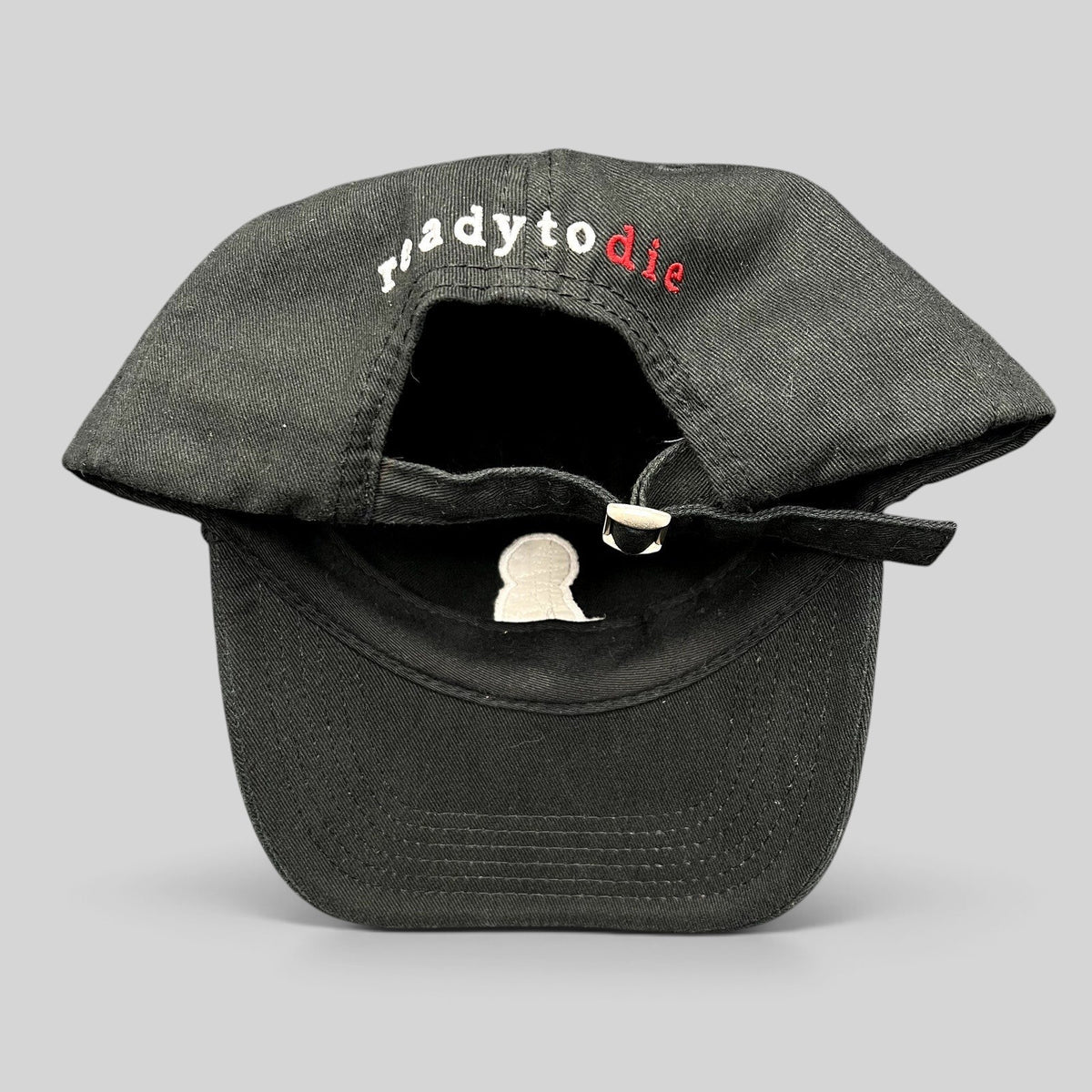 Raree Finds black strapback hat featuring Ready To Die embroidered text in white and red on the back with metal slide