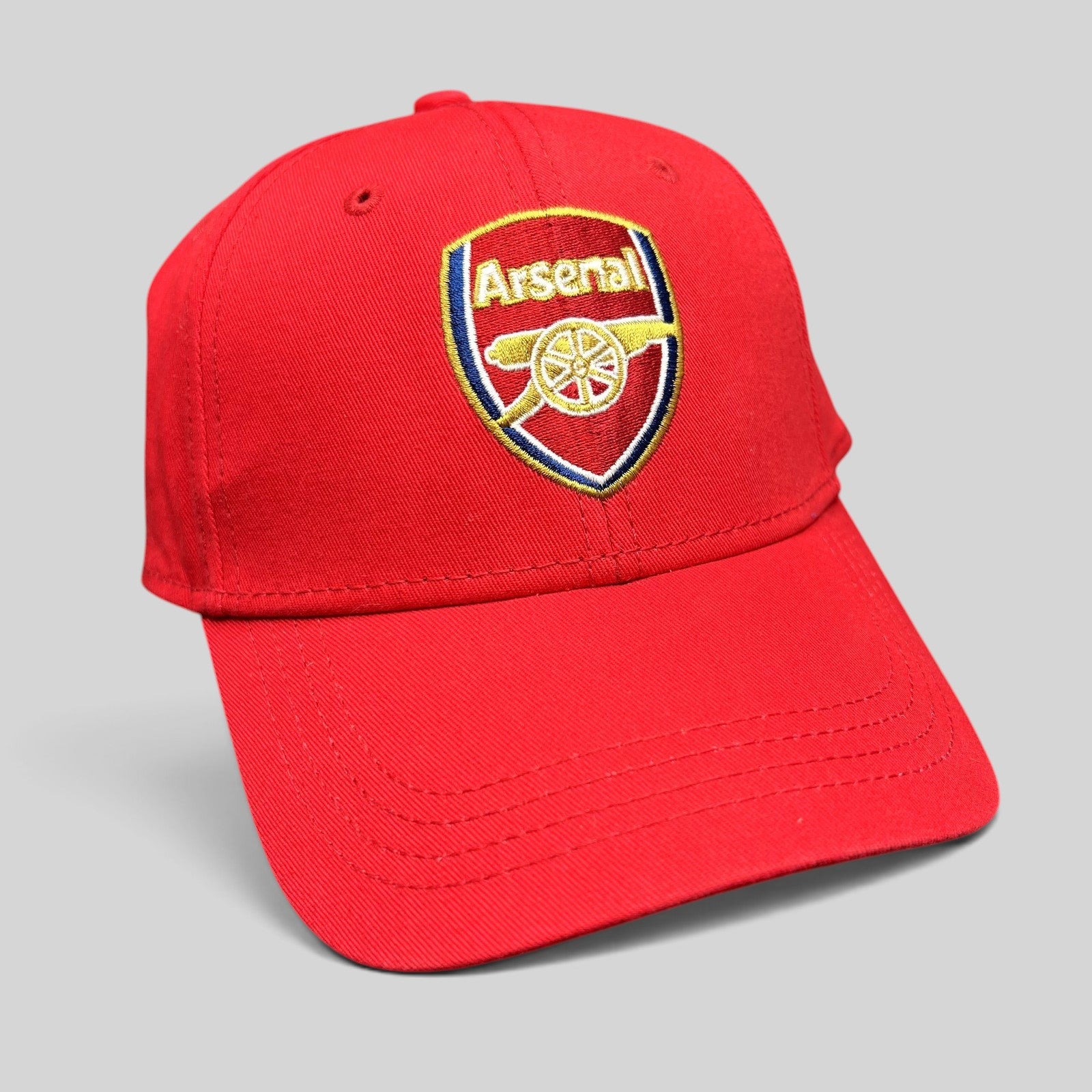 Raree Finds red Arsenal FC strapback hat with an embroidered cannon crest logo on the front and a curved brim.