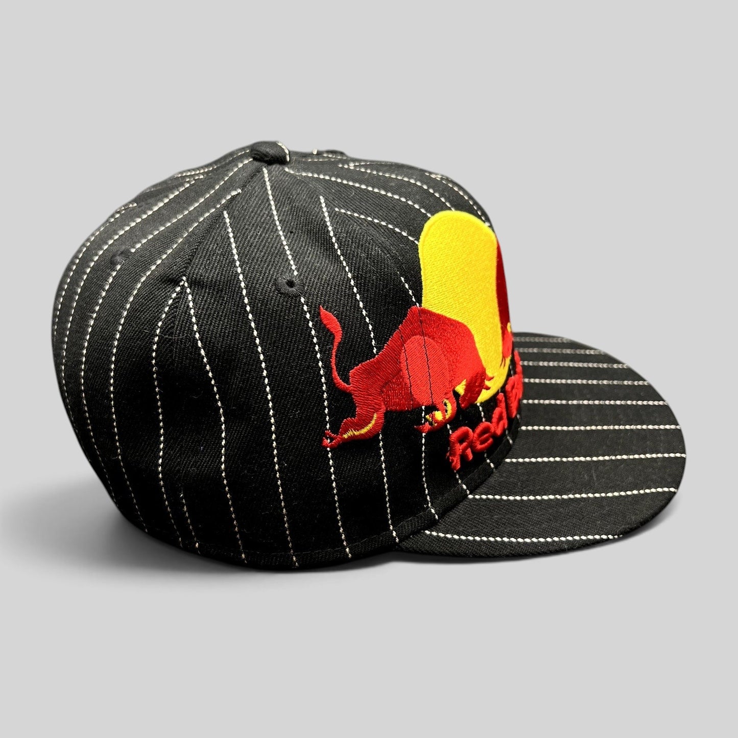Raree Finds black wool-blend New Era 59FIFTY fitted hat with white pinstripes and embroidered Red Bull logo