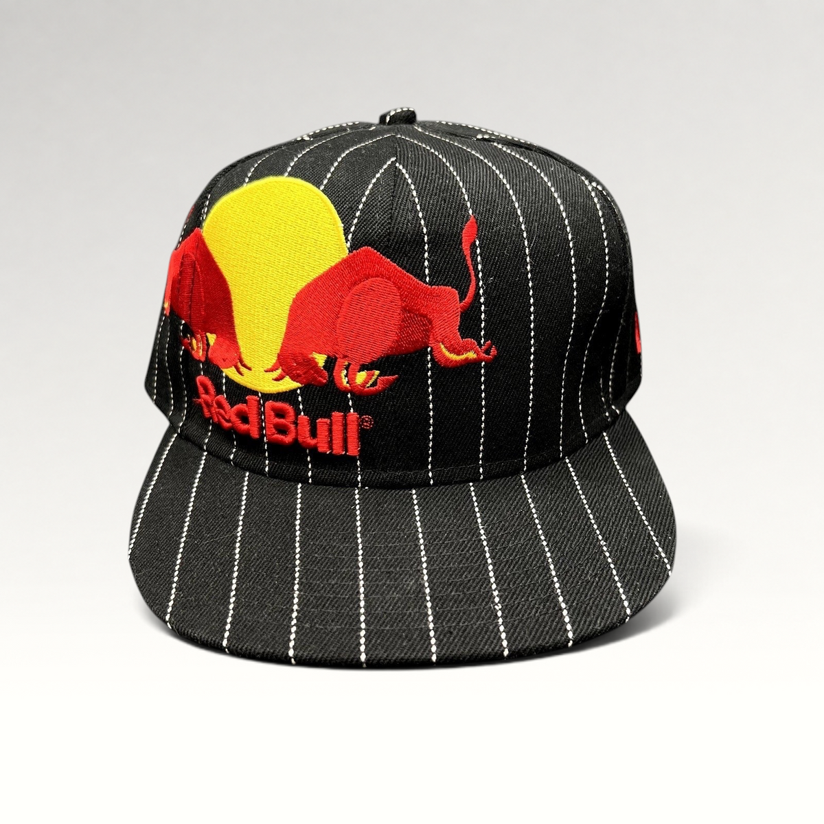 Raree Finds New Era 59FIFTY black fitted hat with white pinstripes and embroidered Red Bull logo on the front.