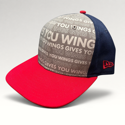 Raree Finds New Era Red Bull snapback hat with grey slogan print, navy side panels, and a bright red brim.