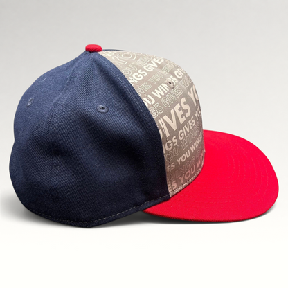 Raree Finds New Era Red Bull snapback hat with grey slogan print, navy side panels, and a bright red brim.