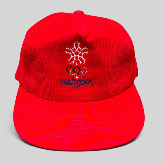 Raree Finds vintage red corduroy snapback hat featuring the 1988 Calgary Olympics Nakiska snowflake and rings logo.