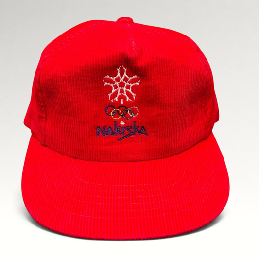 Raree Finds vintage red corduroy snapback hat featuring the 1988 Calgary Olympics Nakiska snowflake and rings logo.