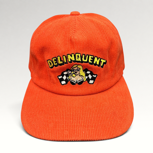 Raree Finds red corduroy snapback hat featuring an embroidered Delinquent pinup girl and checkered racing flags.