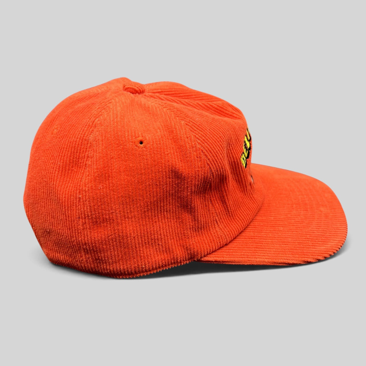 Raree Finds red corduroy snapback hat with structured crown and flat brim, side profile view.