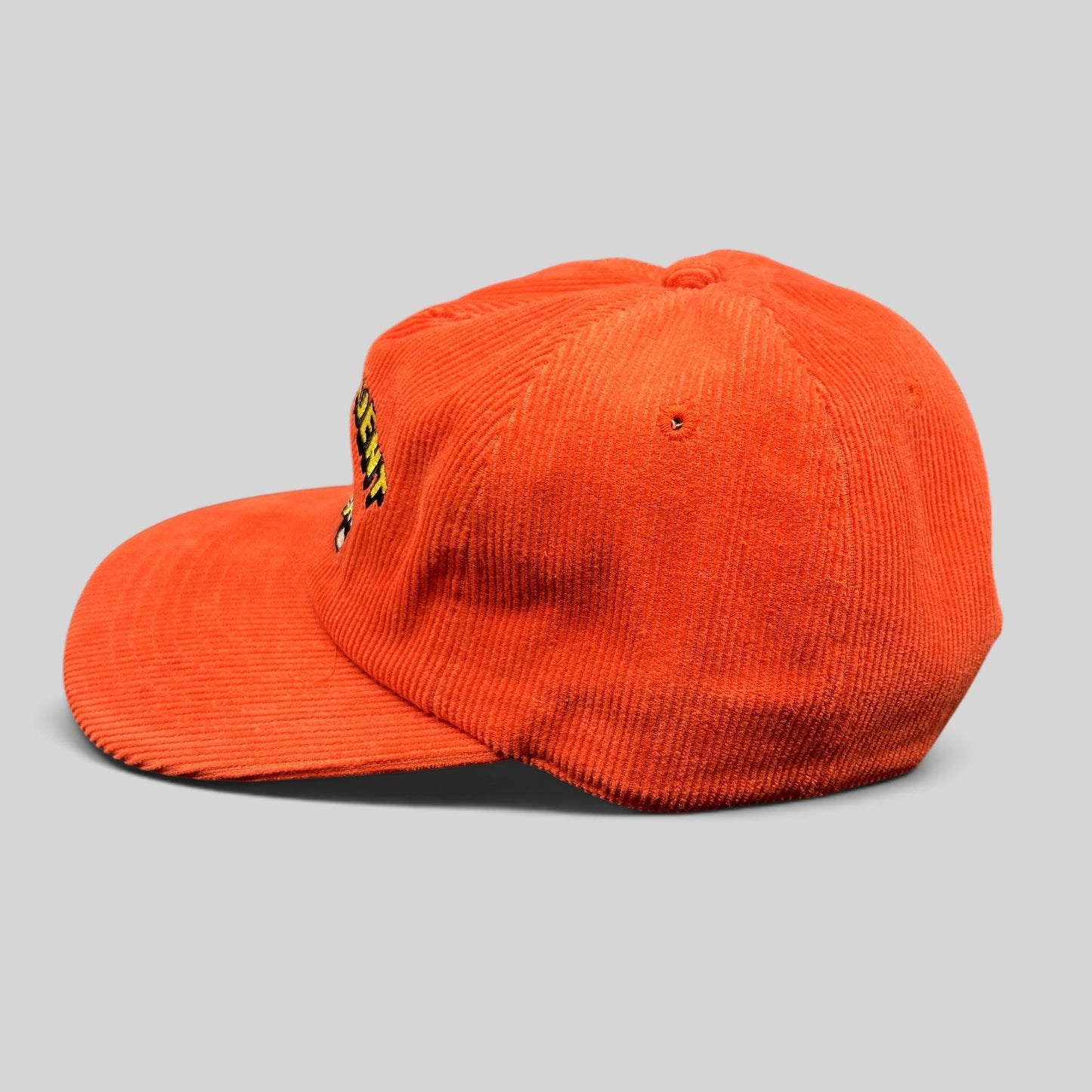 Raree Finds red corduroy snapback hat with embroidered racing pinup graphic and flat brim, side profile view.