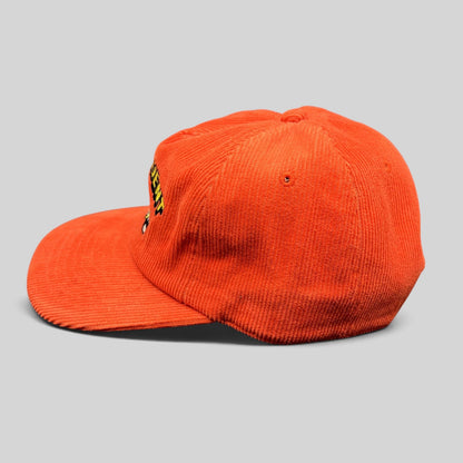 Raree Finds red corduroy snapback hat with embroidered racing pinup graphic and flat brim, side profile view.