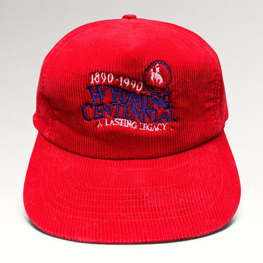 Raree Finds vintage red corduroy snapback hat featuring embroidered Wyoming Centennial 1890-1990 cowboy logo graphics.
