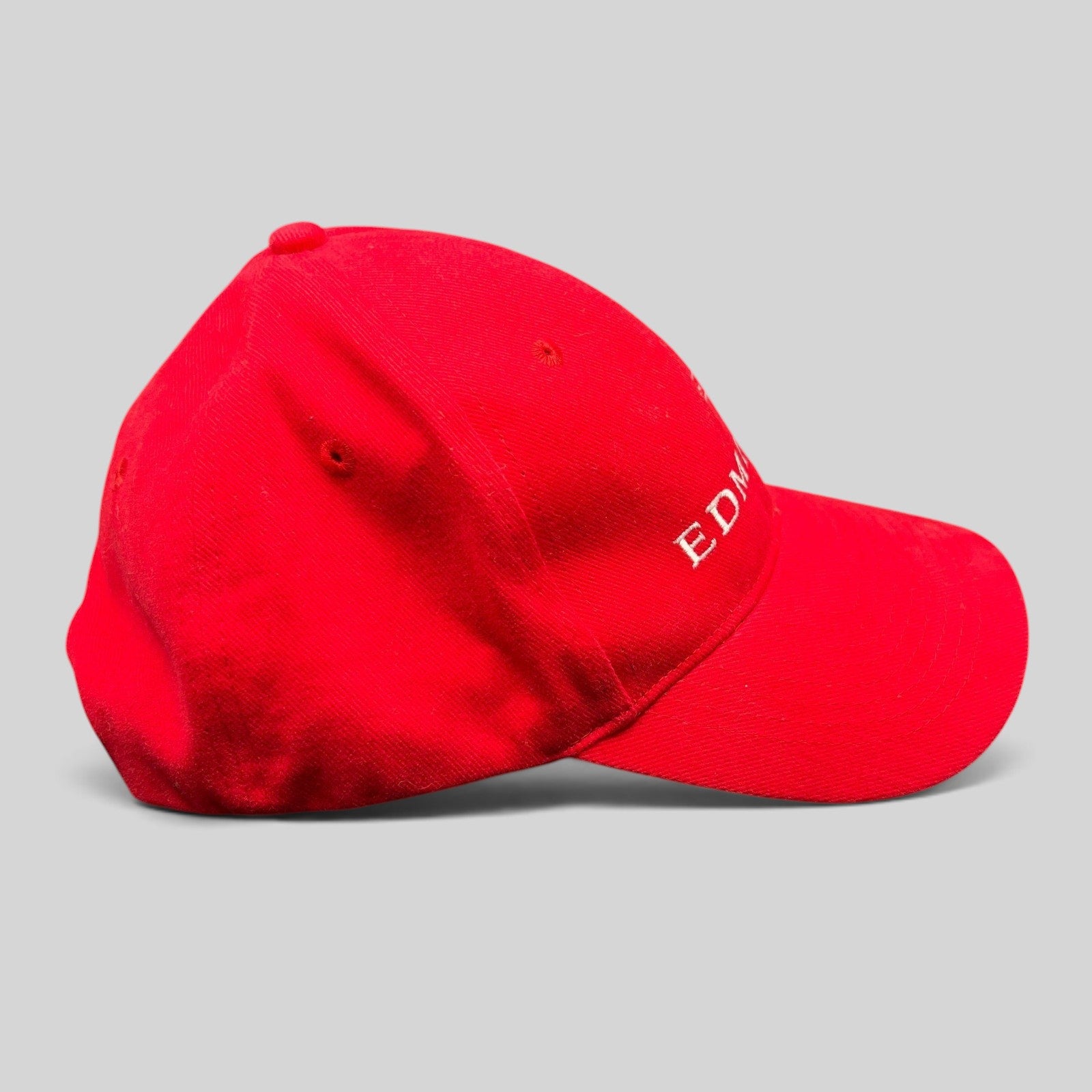 Raree Finds red cotton snapback hat with white Edmiston yachting logo embroidery, side profile view.
