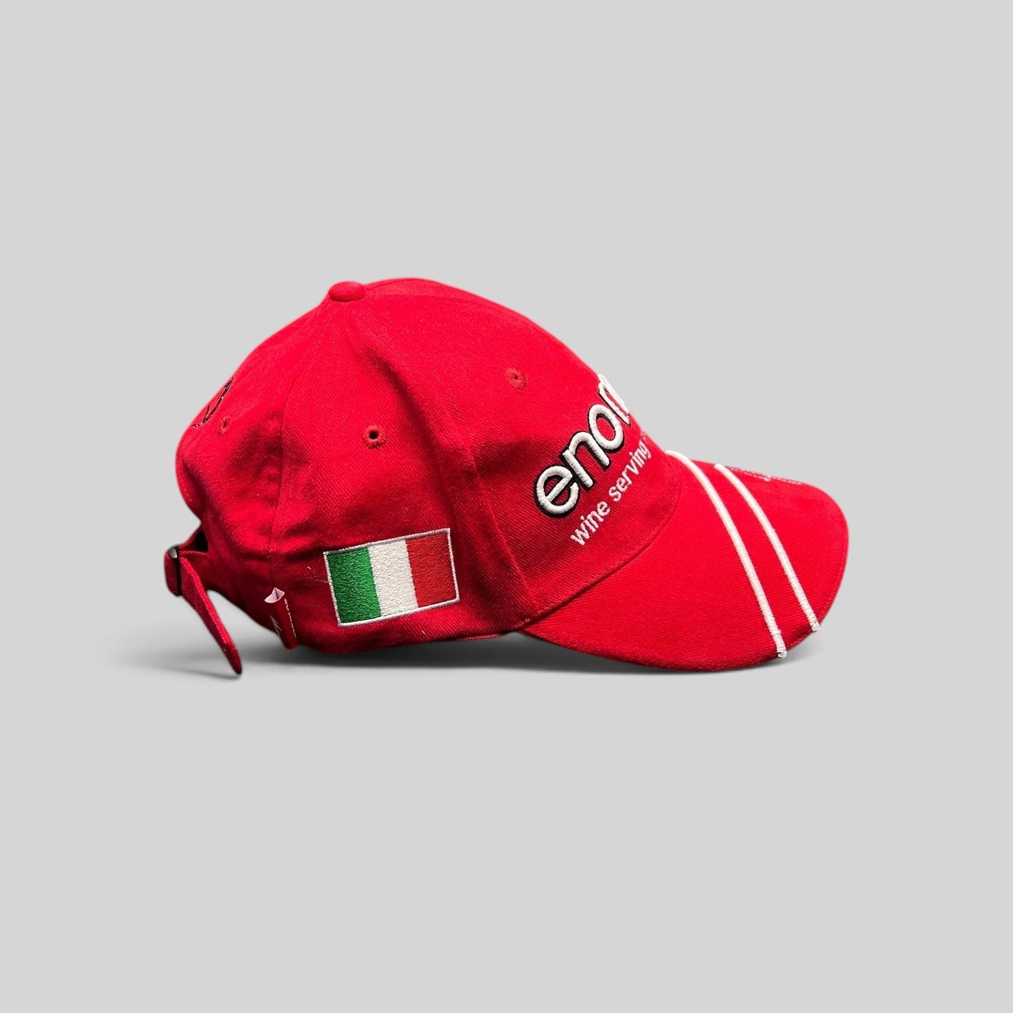 Raree Finds red Enomatic Ferrari racing cap with Italian flag embroidery, white brim stripes, and adjustable strapback.