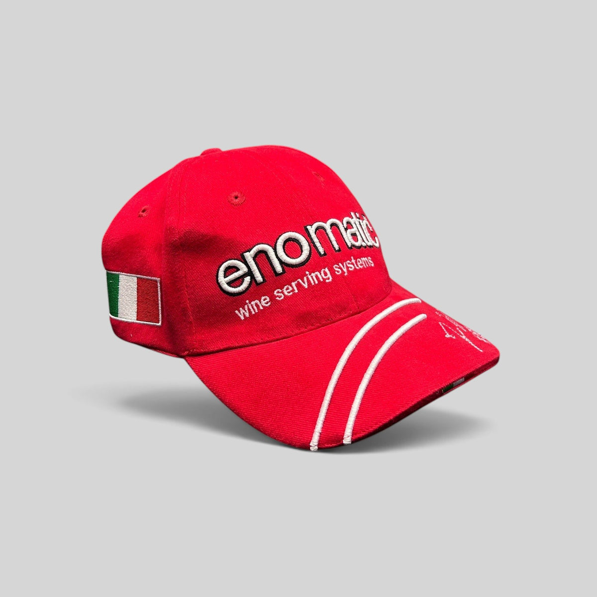 Raree Finds red Enomatic Ferrari racing cap with white embroidery, Italian flag patch, and curved brim detail.